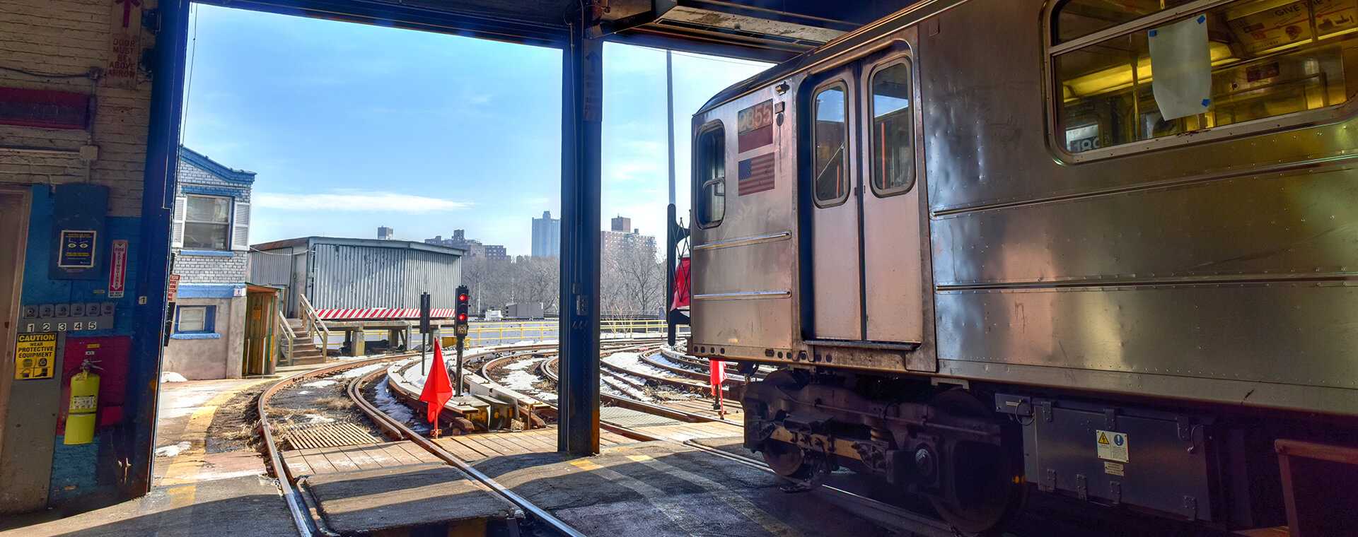 A train at stopped at a traffic light.