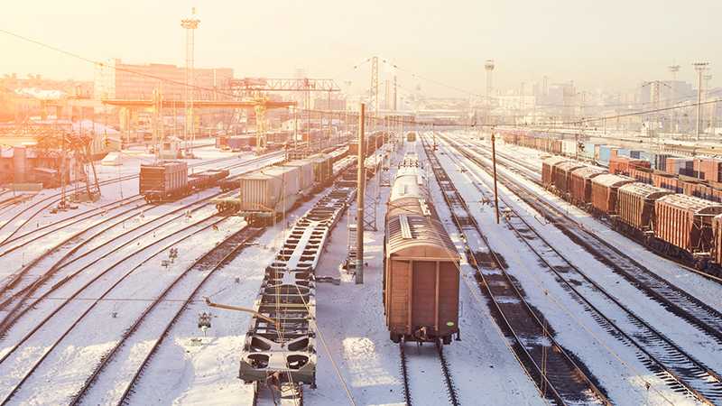 A train yard covered in snow.
