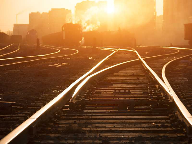 A train track at sunset.